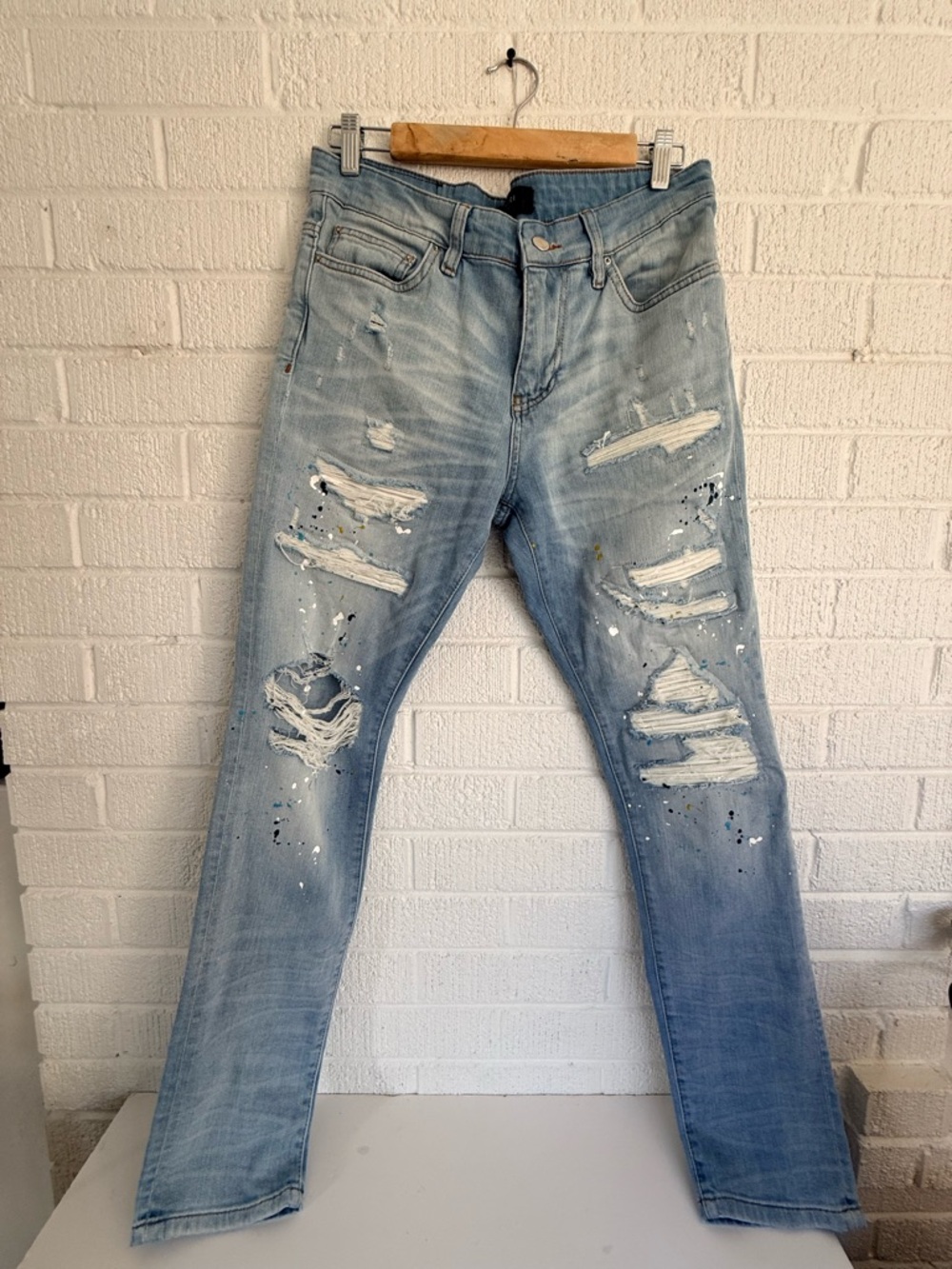 AMIRI Light Blue Distressed Skinny Jeans with Paint Splatter
